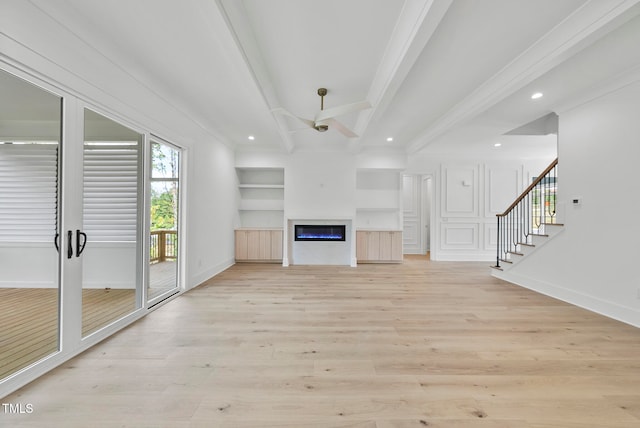 unfurnished living room featuring light hardwood / wood-style floors, crown molding, beam ceiling, and ceiling fan