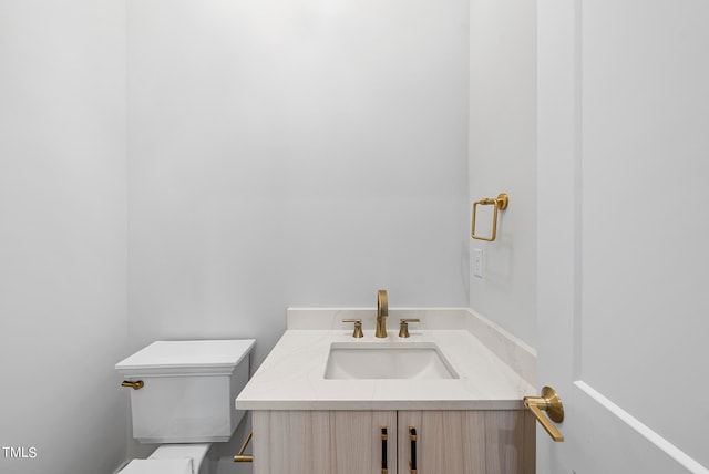 bathroom with vanity and toilet