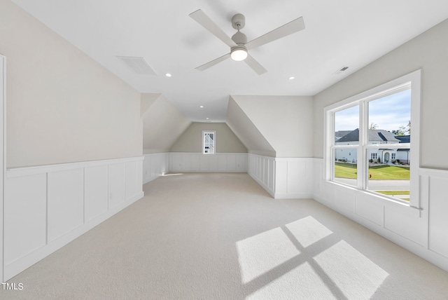 bonus room featuring light carpet, ceiling fan, and vaulted ceiling