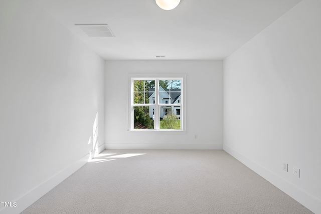 unfurnished room with carpet floors