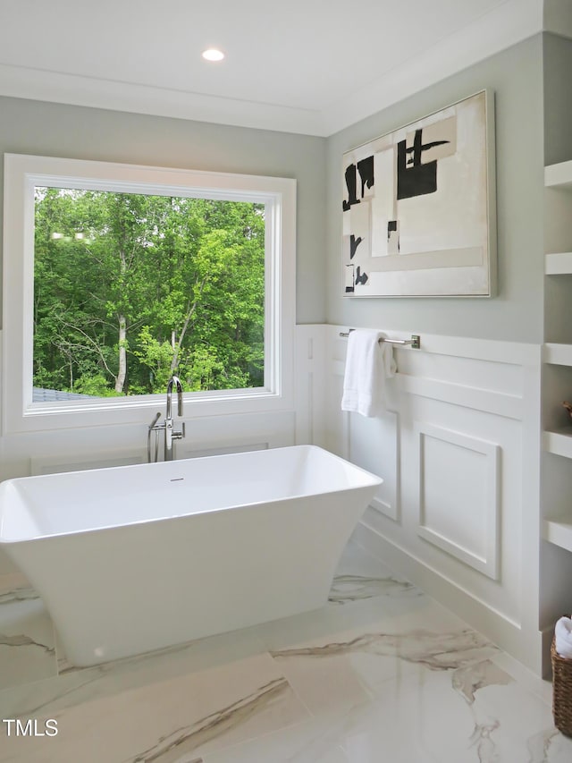 2506 Silas Peak Ln, Apex, NC 27523 - bathroom featuring a wainscoted wall, marble finish floors, a freestanding tub, recessed lighting, and a sink