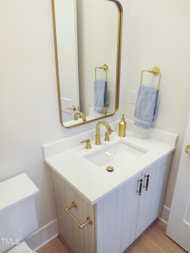 2506 Silas Peak Ln, Apex, NC 27523 - half bathroom featuring vanity and wood finished floors