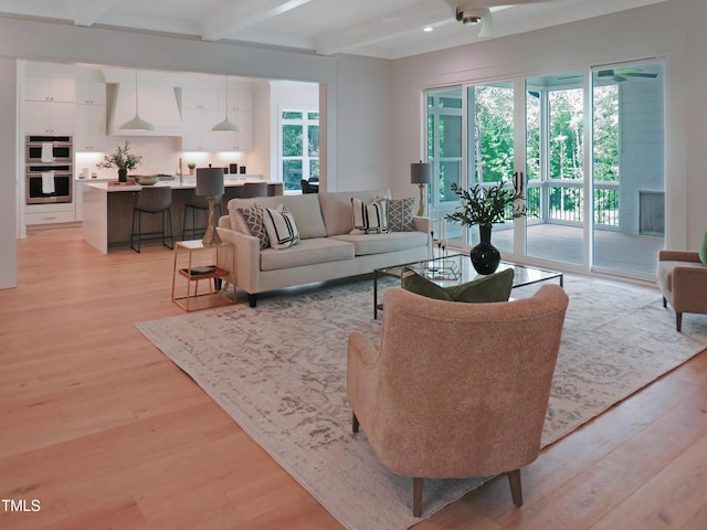2506 Silas Peak Ln, Apex, NC 27523 - living area featuring beamed ceiling, light wood-type flooring, and recessed lighting