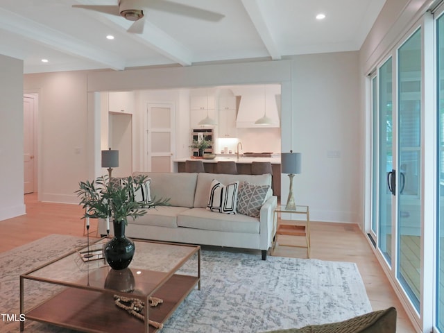 2506 Silas Peak Ln, Apex, NC 27523 - living area featuring beam ceiling, light wood finished floors, ceiling fan, baseboards, and recessed lighting