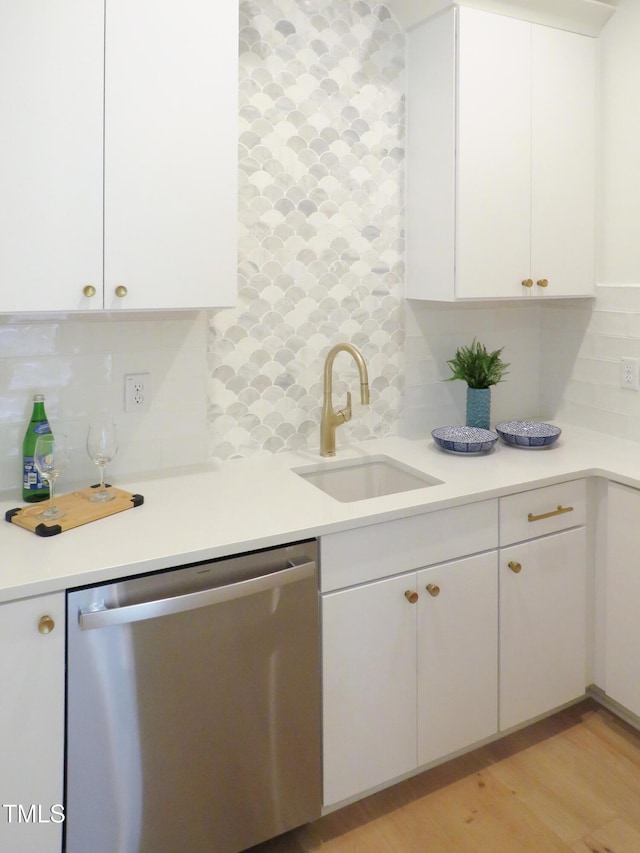 2506 Silas Peak Ln, Apex, NC 27523 - kitchen featuring dishwasher, a sink, decorative backsplash, white cabinets, and light countertops