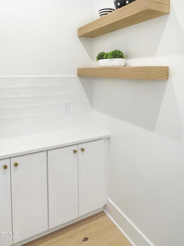 2506 Silas Peak Ln, Apex, NC 27523 - detailed view of tasteful backsplash and wood finished floors