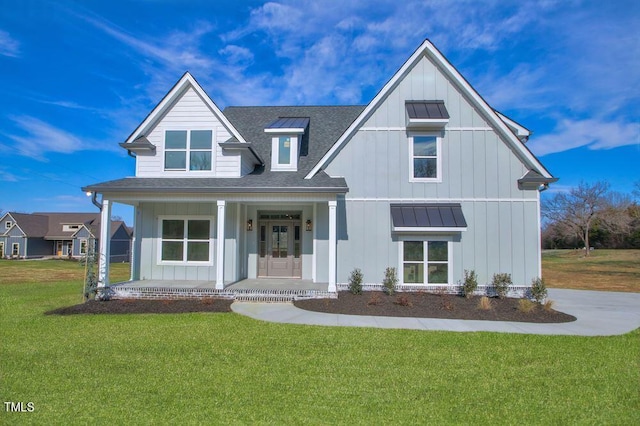 view of front of house featuring a front lawn and a porch