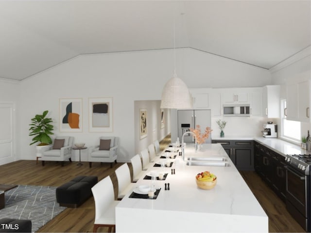 dining area featuring dark hardwood / wood-style floors, vaulted ceiling, sink, and crown molding