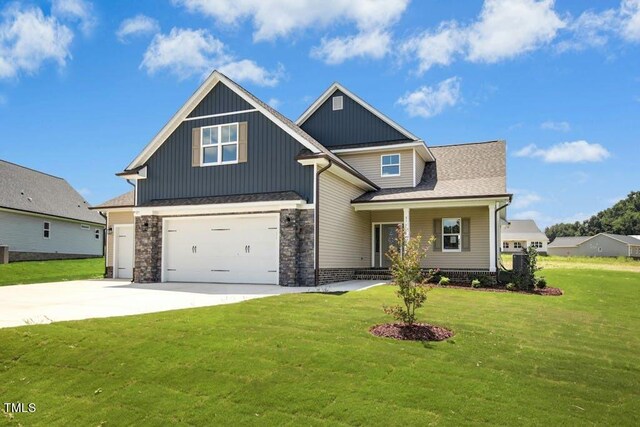 view of front facade with a garage and a front yard