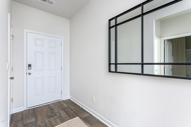 entryway with dark hardwood / wood-style floors