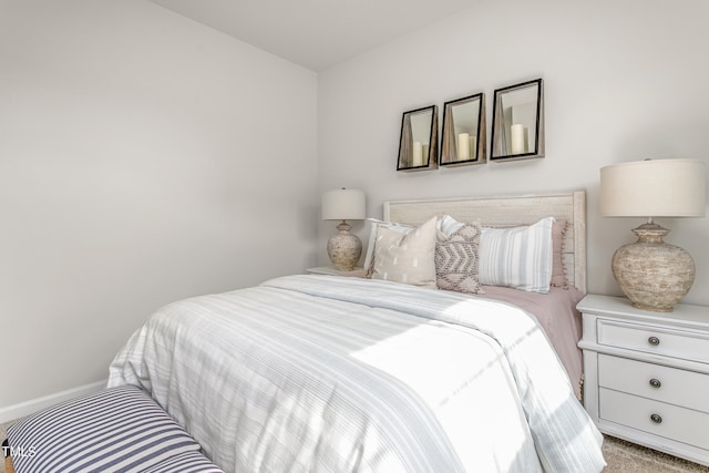 bedroom with light colored carpet