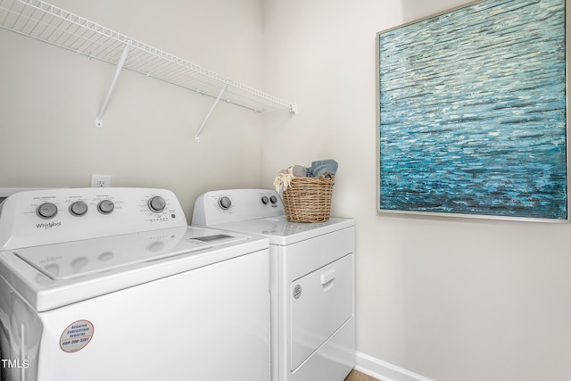 laundry area with separate washer and dryer