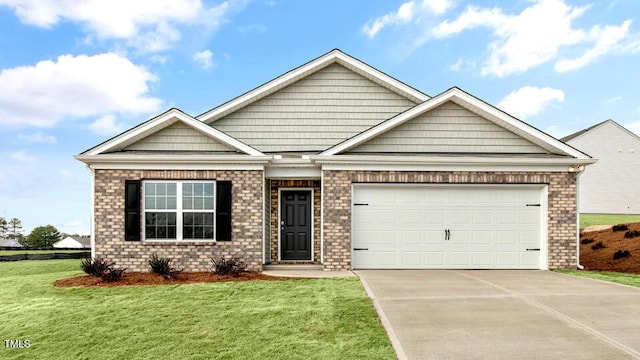 view of front of home featuring brick siding, an attached garage, concrete driveway, and a front yard