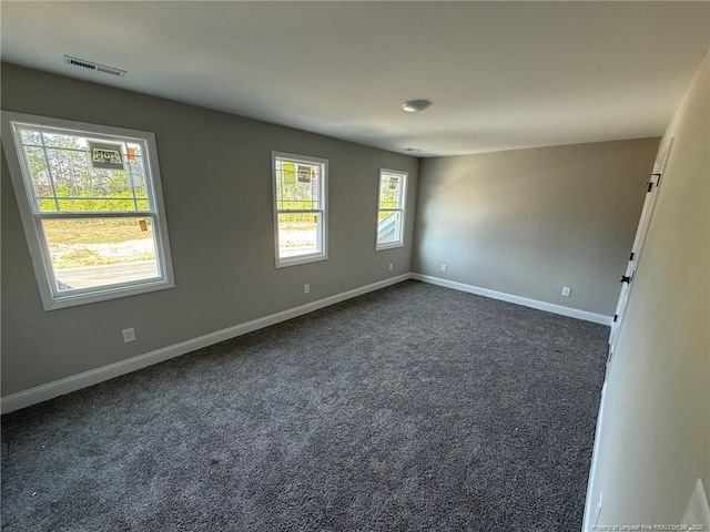 3013 Deeside Ct, Fayetteville, NC 28306 - spare room featuring dark carpet, baseboards, and visible vents