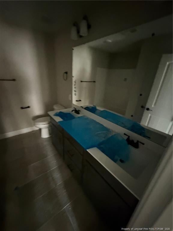 3013 Deeside Ct, Fayetteville, NC 28306 - bathroom with toilet, vanity, tile patterned floors, and baseboards