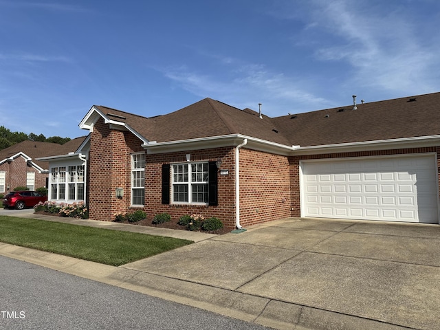 4712 Fox Fern Ln, Raleigh, NC 27604 - view of front facade with brick siding, concrete driveway, a garage, and roof with shingles