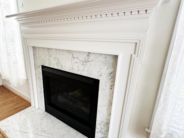 4712 Fox Fern Ln, Raleigh, NC 27604 - detailed view of a premium fireplace, baseboards, and wood finished floors