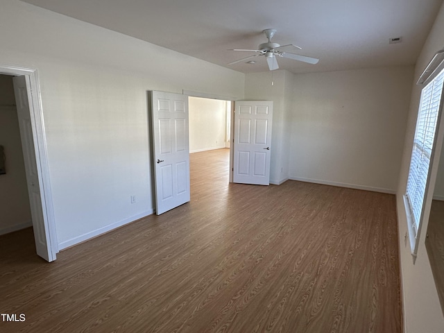 4712 Fox Fern Ln, Raleigh, NC 27604 - unfurnished bedroom with dark wood-type flooring, baseboards, and ceiling fan