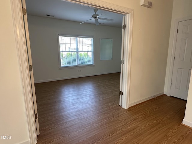 4712 Fox Fern Ln, Raleigh, NC 27604 - empty room featuring dark wood-style floors, a ceiling fan, and baseboards
