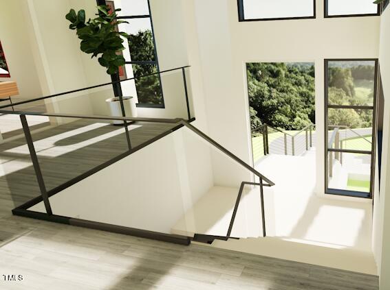 stairs with hardwood / wood-style flooring