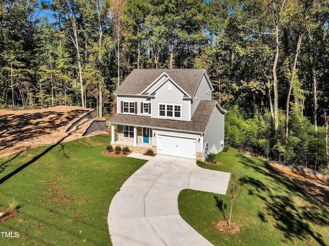 traditional-style home featuring a garage, concrete driveway, a shingled roof, a front yard, and a porch