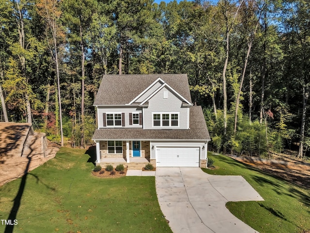 view of front facade with a garage and a front lawn