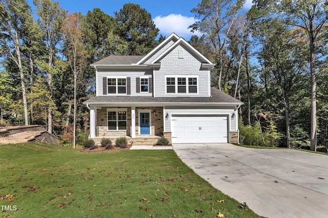 craftsman house with a front yard, covered porch, and a garage