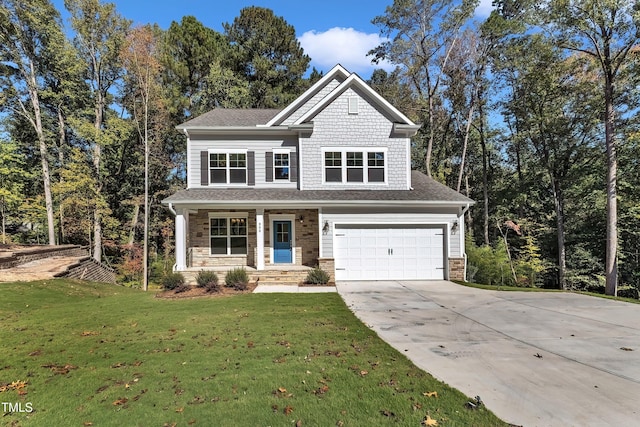 view of front of house with a front lawn, driveway, a garage, and stone siding