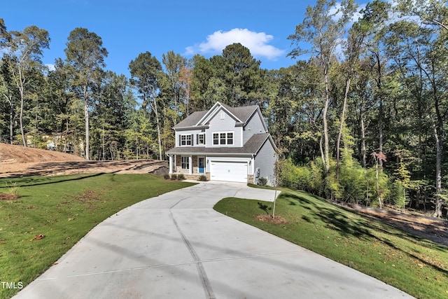 view of front facade with driveway, a forest view, a front yard, and a garage