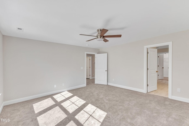 unfurnished bedroom featuring light colored carpet and ceiling fan