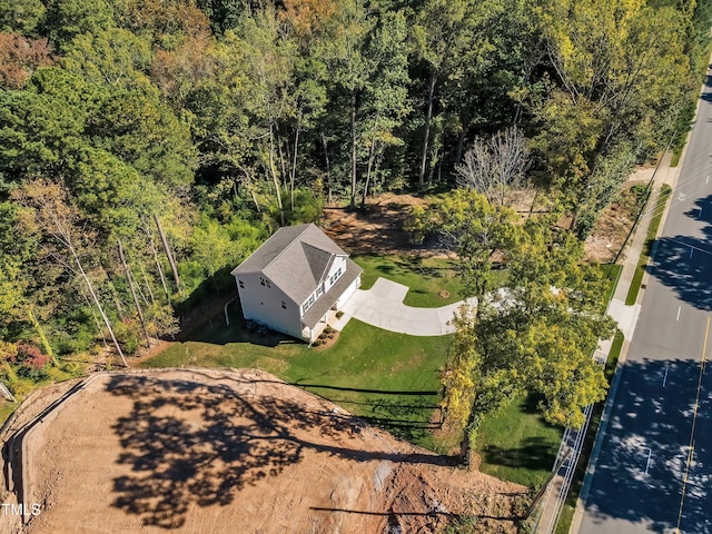 drone / aerial view with a view of trees
