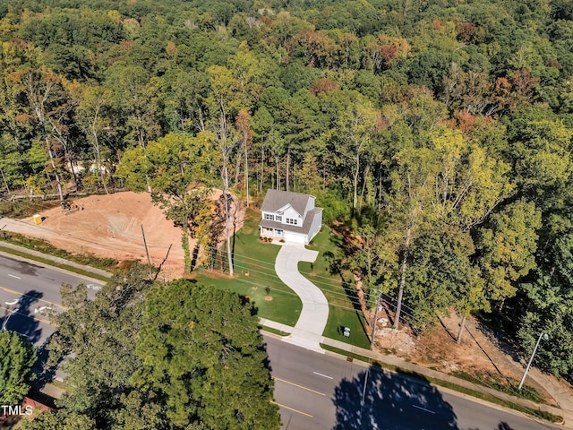 bird's eye view featuring a forest view