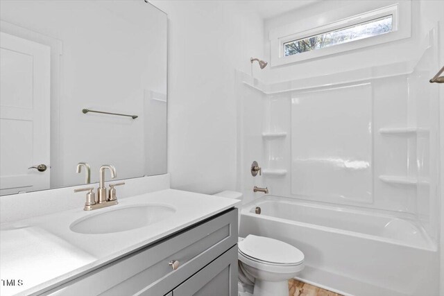 full bathroom featuring vanity, toilet, and shower / bathtub combination