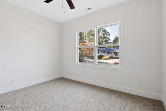 unfurnished room with carpet flooring and ceiling fan