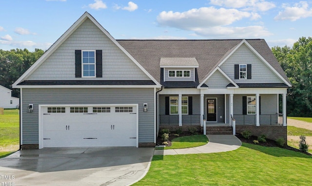 craftsman inspired home featuring a garage, a front lawn, and a porch