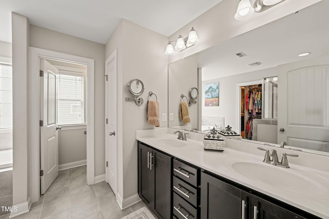 bathroom with vanity and tile patterned floors