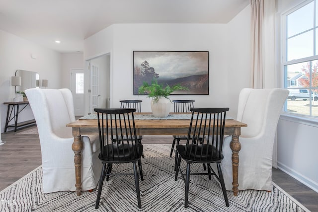 dining area featuring a healthy amount of sunlight, baseboards, and wood finished floors