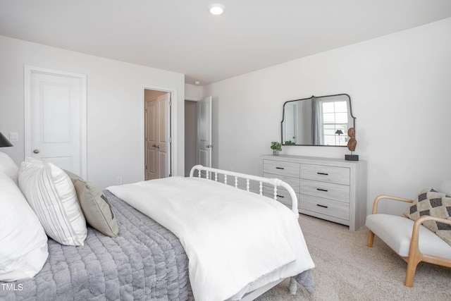 bedroom featuring light carpet