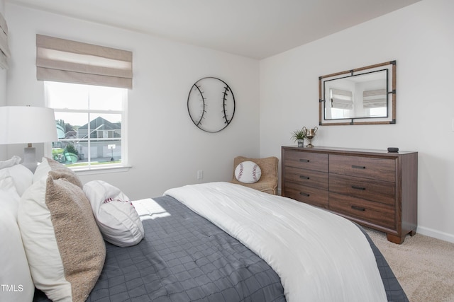 bedroom featuring carpet flooring and baseboards