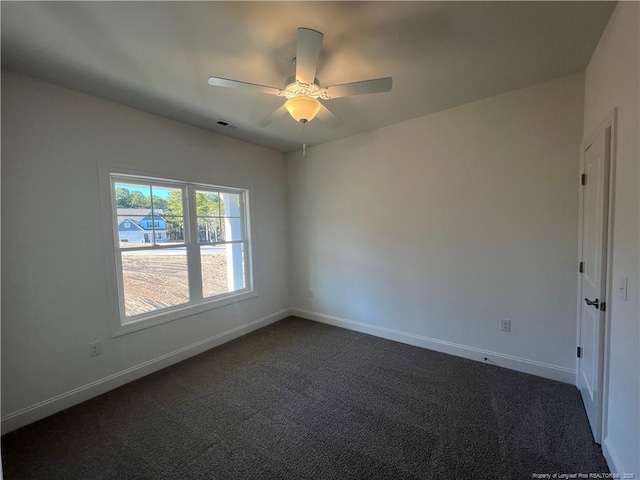 carpeted empty room with ceiling fan