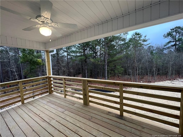 wooden deck featuring ceiling fan