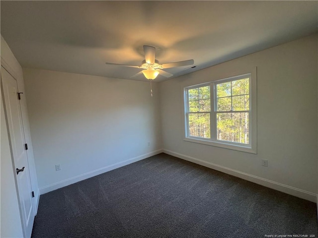 carpeted empty room with ceiling fan