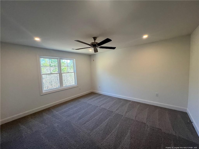 carpeted empty room featuring ceiling fan