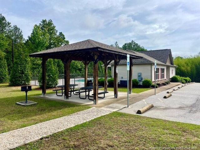 surrounding community with a gazebo, a yard, and a patio