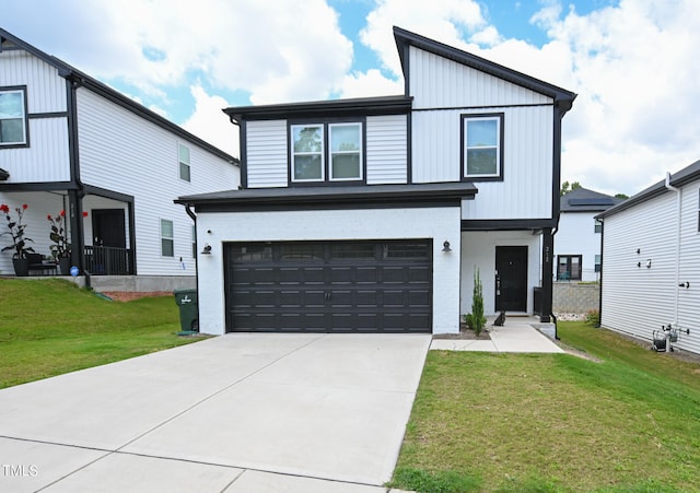 view of front of house featuring a front lawn and a garage