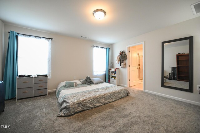 carpeted bedroom with ensuite bathroom