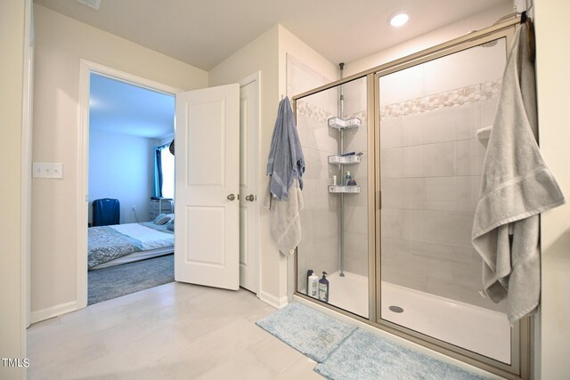 bathroom featuring walk in shower and tile patterned floors