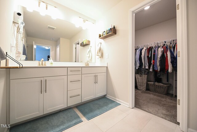 bathroom featuring double vanity and tile patterned floors