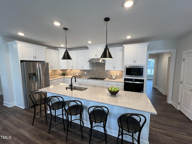 kitchen with pendant lighting, stainless steel refrigerator with ice dispenser, wall oven, white cabinets, and built in microwave