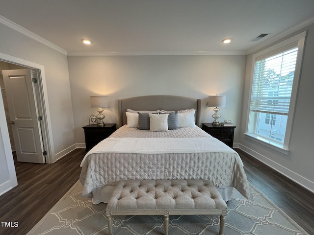 bedroom with crown molding and dark wood-type flooring